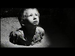 From Schindler's List movie, boy up to his
                    chest in latrine waste